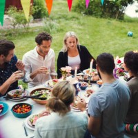 high angle view of friends enjoying dinner at garden party - garden decoration stock pictures, royalty-free photos & images