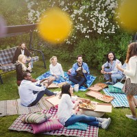 high angle view of friends having snacks during summer party at yard - garden decoration stock pictures, royalty-free photos & images