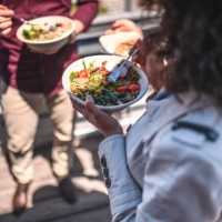 high angle view of senior female enjoying lunch outdoors - junk food stock pictures, royalty-free photos & images
