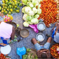 high angle view of vendors selling a selection of fresh vegetables on a street market. - food stock pictures, royalty-free photos & images