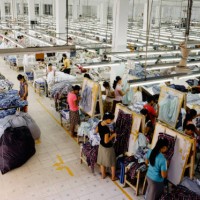 high angle view of workers in garment factory - fashion stock-fotos und bilder