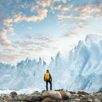 hiker admiring the perito moreno glacier at sunset, argentina - travel stock pictures, royalty-free photos & images