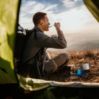 hiking young man and lunch break - food stock pictures, royalty-free photos & images