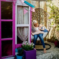 hipster mother sitting in the back yard swing with daughter - garden decoration stock pictures, royalty-free photos & images