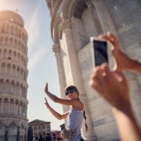 holding up photos of the leaning tower of pisa - travel stock pictures, royalty-free photos & images