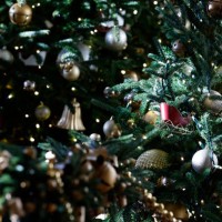 Holiday decorations are seen on a Christmas tree in the East Garden Room during a media preview of the 2024 holiday decorations at the White House on...