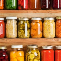 home canning fruit and vegetable food preserves in storage shelves - food stock pictures, royalty-free photos & images