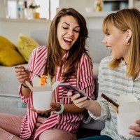 home delivery of food for two friends - junk food stock pictures, royalty-free photos & images