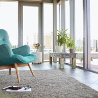 home interior with armchair, tablet and view on roof terrace - home decoration stock pictures, royalty-free photos & images