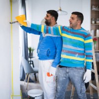 home painters working as a team - home decoration stockfoto's en -beelden