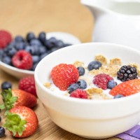 homemade granola or muesli with oat flakes, corn flakes, dried fruits with fresh berries in a bowl. healthy breakfast - junk food stock pictures, royalty-free photos & images