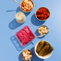 homemade kimchee, pickled cucumbers, tomatoes, cabbage with beets and sauerkraut on the blue background - food stock pictures, royalty-free photos & images