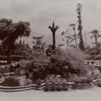 Hong KongChina, A water fountain surrounded by foliage forms the centrepiece of an ornamental pond in Hong Kong's Botanical Gardens.Original...