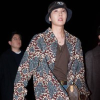 Hope wears a bob hat, a colored checkered pattern oversize blazer jacket , a brown t-shirt, a brown leather monogram logo print bag from Louis...