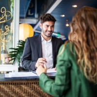 hotel receptionist assisting guest for checking in - home decoration stock pictures, royalty-free photos & images