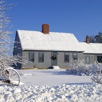 house covered in snow with two chimneys and many windows - garden decoration stock pictures, royalty-free photos & images