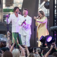 Howard Donald, Gary Barlow and Mark Owen from Take That perform on stage during the world premiere of 'Greatest Days', the cinematic adaptation of...