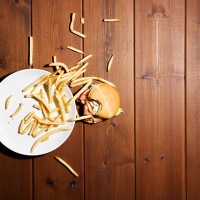 humburger and frensh fries on floor - food stock pictures, royalty-free photos & images