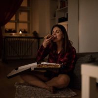 hungry woman having a slice of pizza - junk food stock pictures, royalty-free photos & images