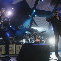 Ian Moss and Jimmy Barnes of Cold Chisel perform during a Cold Chisel concert at ANZ Stadium on December 5, 2009 in Sydney, Australia.