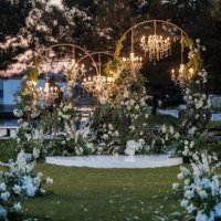 illuminated outdoor wedding reception under the green pines - garden decoration stock pictures, royalty-free photos & images