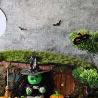 image of witch's house and garden night scene, string witch stood beside broom on slate paddle stone steps, orange fondant icing pumpkin jack o'lanterns, artificial grass - garden decoration stock pictures, royalty-free photo