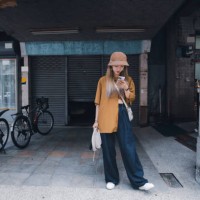 in asia, a young taiwanese waits for friends on the street. - fashion stock pictures, royalty-free photos & images