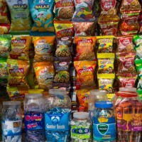 indian chips and savories for sale at market stand - junk food stock pictures, royalty-free photos & images