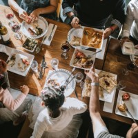 indian friends and family share traditional meal together - food stock pictures, royalty-free photos & images