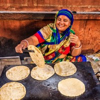 indian street vendor preparing food - chapatti, flat bread - food stock pictures, royalty-free photos & images