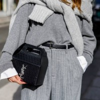 Influencer Alexandra Lapp, wearing a Seidensticker blouse in white, Rossi pinstriped pants in grey, a H&M cashmere sweater in grey, a Allude knit...