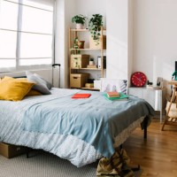 interior of messy teenage bedroom with bed and workplace. - home decoration stock pictures, royalty-free photos & images
