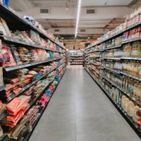 interior of supermarket full of grocery items in rows with shelf displayed - food stock pictures, royalty-free photos & images