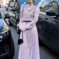 Irina Kro Eicke wears pink dress with belt, bag outside Genny during the Milan Fashion Week Womenswear Fall/Winter 2025/2026 on February 27, 2025 in...