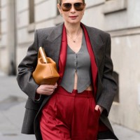 Iryna Thater wears a LaMiaMe Collection suit, Bottega Veneta jacket, Fendi bag and Chloe sunglasses outside the Miss Sohee show during The Haute...