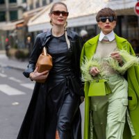 Iryna Thater wears skirt & top and coat sustainable leather from Nanushka, brown knee high boots Jimmy Choo, bag Fendi, Jacquemus sunglasses & Salome...