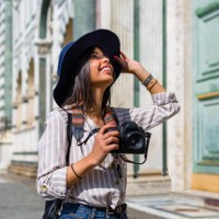 italy, florence, happy young tourist with camera looking up - travel stock pictures, royalty-free photos & images