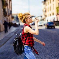 italy, verona, woman drinking coffee to go in the city - junk food stock pictures, royalty-free photos & images
