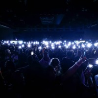 Jackson State University students raise their cell phones and illuminate the crowd during Thee Homecoming Concert at the Lee E. Williams Athletic &...