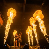 January 2023, Baden-Wuerttemberg, Rust: DJ Bobo and other musicians stand on stage during the premiere of his show at Europa-Park while flames shoot...