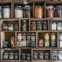 jars containing spices and herbs in diy wooden rack - food stock pictures, royalty-free photos & images