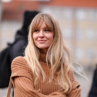 Jeanette Madsen wears a brown ribbed wool pullover with turtleneck , outside Wood Wood, during the Copenhagen Fashion Week AW24 on January 31, 2024...