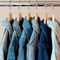 jeans jackets and retro shirts on second hand market / flea market - fashion stock pictures, royalty-free photos & images
