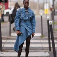 Jennifer Kolomoni is seen wearing white heels, black tights, a denim jeans skirt and a denim jeans jacket along with a dark red Loewe bag before...