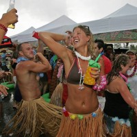 Jimmy Buffett concert at the Tweeter Center. Nikki McKinney of Weymouth dances with others out in the parking lot of the Tweeter Center.