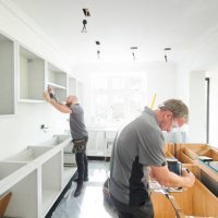 joinery team fitting a kitchen - home decoration stock pictures, royalty-free photos & images