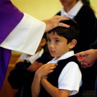 Jonathan Morales receives a blessing from Father Jose Vega, who places his hand on his head instead of giving him a Communion Wafer, because...