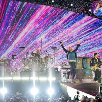 Jonny Buckland, Will Champion, Chris Martin and Guy Berryman of Coldplay perform on a stop of the band's Music of the Spheres world tour at Allegiant...