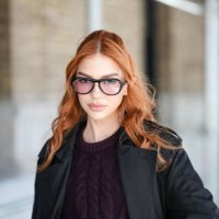 Jordanna Maia wears black sunglasses, dark brown sweater, black trench coat,outside Coach, during the New York Fashion week Fall/Winter 2025 on...
