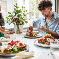 joyful brunch amongst urban friends - food stock pictures, royalty-free photos & images